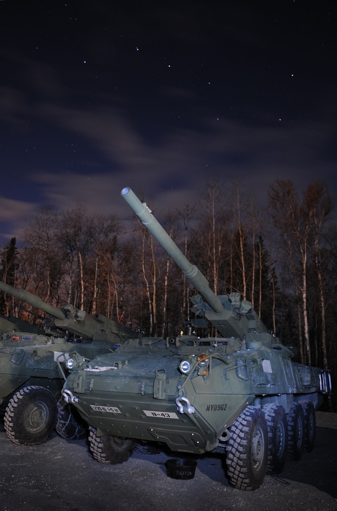Night sky over large tactical vehicle