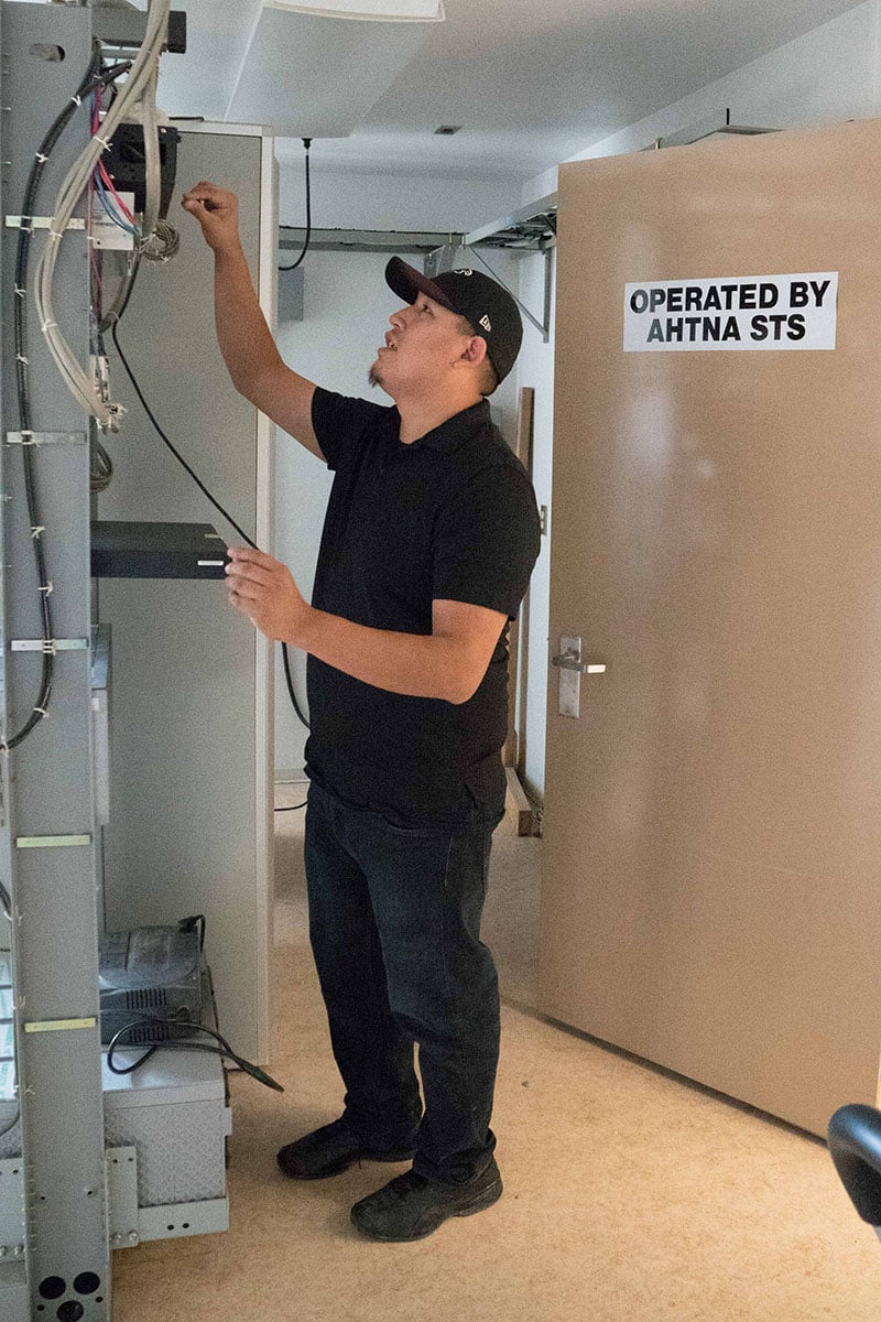 Man looking at plugs and wires
